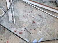 Blood drops stain glass shards at an oncology dispensary damaged by a Russian guided bomb strike in Zaporizhzhia, Ukraine, on November 7, 20...