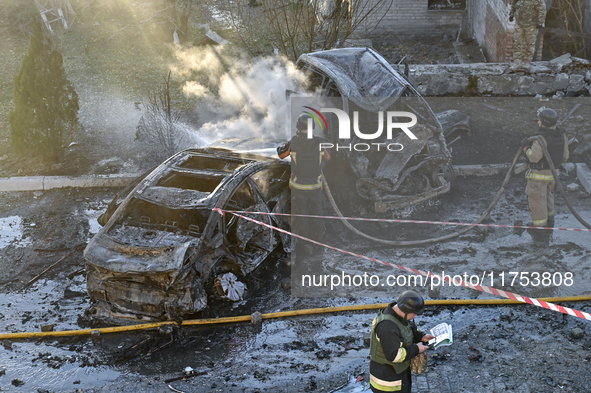 Rescuers put out burning cars at an oncology dispensary damaged by a Russian guided bomb in Zaporizhzhia, Ukraine, on November 7, 2024. Eigh...