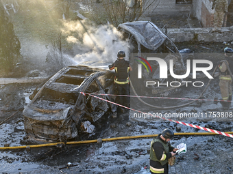 Rescuers put out burning cars at an oncology dispensary damaged by a Russian guided bomb in Zaporizhzhia, Ukraine, on November 7, 2024. Eigh...