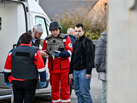 Paramedics provide first aid to an injured man by an ambulance after a Russian guided bomb in Zaporizhzhia, southeastern Ukraine, on Novembe...