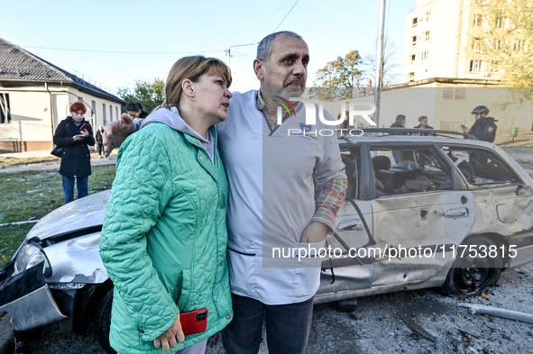 People stay at an oncology dispensary damaged by a Russian guided bomb in Zaporizhzhia, Ukraine, on November 7, 2024. Eight people, includin...