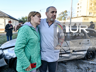 People stay at an oncology dispensary damaged by a Russian guided bomb in Zaporizhzhia, Ukraine, on November 7, 2024. Eight people, includin...