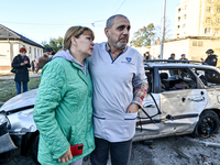 People stay at an oncology dispensary damaged by a Russian guided bomb in Zaporizhzhia, Ukraine, on November 7, 2024. Eight people, includin...