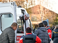 An injured man exits an ambulance after a Russian guided bomb attack in Zaporizhzhia, Ukraine, on November 7, 2024. Eight people, including...