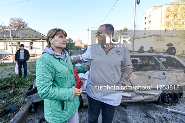 People stay at an oncology dispensary damaged by a Russian guided bomb in Zaporizhzhia, Ukraine, on November 7, 2024. Eight people, includin...