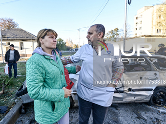 People stay at an oncology dispensary damaged by a Russian guided bomb in Zaporizhzhia, Ukraine, on November 7, 2024. Eight people, includin...