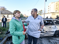 People stay at an oncology dispensary damaged by a Russian guided bomb in Zaporizhzhia, Ukraine, on November 7, 2024. Eight people, includin...