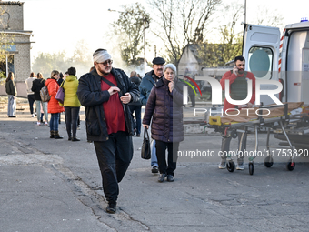 People are at an oncology dispensary damaged by a Russian guided bomb strike in Zaporizhzhia, Ukraine, on November 7, 2024. Eight people, in...