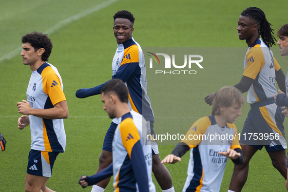 Real Madrid players (from L to R) Jesus Vallejo, Vinicius Junior, Luka Modric, and Eduardo Camavinga train during the Real Madrid training s...