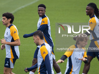 Real Madrid players (from L to R) Jesus Vallejo, Vinicius Junior, Luka Modric, and Eduardo Camavinga train during the Real Madrid training s...