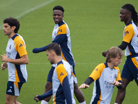 Real Madrid players (from L to R) Jesus Vallejo, Vinicius Junior, Luka Modric, and Eduardo Camavinga train during the Real Madrid training s...