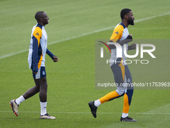 Ferland Mendy (left) and Antonio Rudiger (right) of Real Madrid CF train during the Real Madrid training session and press conference ahead...