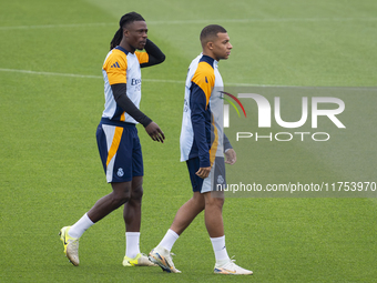 Eduardo Camavinga (left) and Kylian Mbappe (right) of Real Madrid CF train during the Real Madrid training session and press conference ahea...