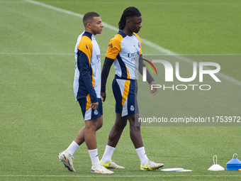 Eduardo Camavinga (right) and Kylian Mbappe (left) of Real Madrid CF train during the Real Madrid training session and press conference ahea...