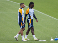 Eduardo Camavinga (right) and Kylian Mbappe (left) of Real Madrid CF train during the Real Madrid training session and press conference ahea...