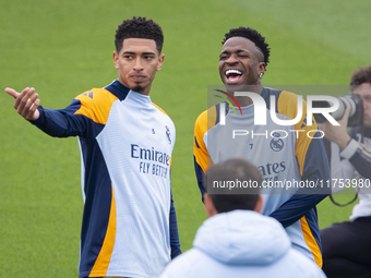 Jude Bellingham of Real Madrid CF (L) and Vinicius Junior of Real Madrid CF (R) train during the Real Madrid training session and press conf...