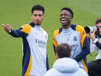 Jude Bellingham of Real Madrid CF (L) and Vinicius Junior of Real Madrid CF (R) train during the Real Madrid training session and press conf...