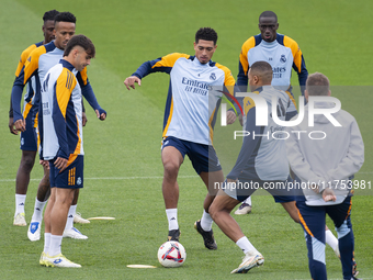 Real Madrid players (from left to right) Eder Militao, Raul Asencio, Eduardo Camavinga, Jude Bellingham, Ferland Mendy, and Kylian Mbappe tr...