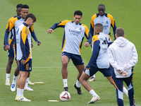 Real Madrid players (from left to right) Eder Militao, Raul Asencio, Eduardo Camavinga, Jude Bellingham, Ferland Mendy, and Kylian Mbappe tr...