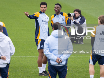 Jude Bellingham of Real Madrid CF (L) and Vinicius Junior of Real Madrid CF (R) train during the Real Madrid training session and press conf...