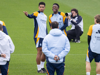 Jude Bellingham of Real Madrid CF (L) and Vinicius Junior of Real Madrid CF (R) train during the Real Madrid training session and press conf...