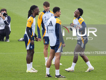 Real Madrid players (from L to R) Eduardo Camavinga, Raul Asencio, Jude Bellingham, and Vinicius Junior train during the Real Madrid trainin...