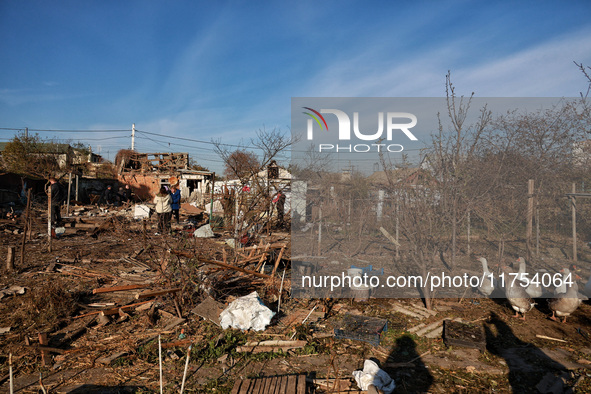 Geese are among the debris covering the yard of a house damaged by an overnight Russian drone attack in Odesa, Ukraine, on November 8, 2024....