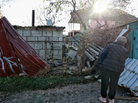 A woman looks at a building damaged by an overnight Russian drone attack in Odesa, Ukraine, on November 8, 2024. One person is killed and ni...