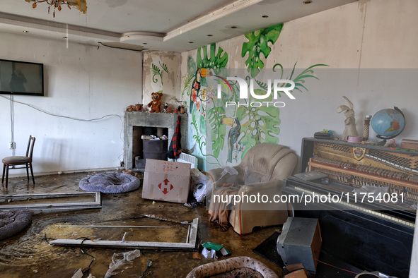 A living room with a piano is in a house damaged by an overnight Russian drone attack in Odesa, Ukraine, on November 8, 2024. One person is...