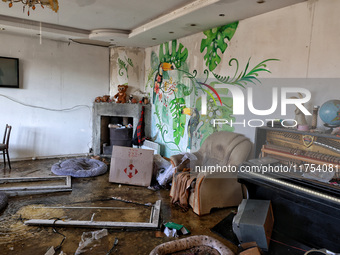 A living room with a piano is in a house damaged by an overnight Russian drone attack in Odesa, Ukraine, on November 8, 2024. One person is...