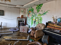 A living room with a piano is in a house damaged by an overnight Russian drone attack in Odesa, Ukraine, on November 8, 2024. One person is...