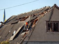 A man is on the roof of a house damaged by an overnight Russian drone attack in Odesa, Ukraine, on November 8, 2024. One person is killed an...