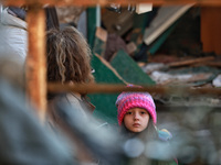 A girl stands near a building damaged by an overnight Russian drone attack in Odesa, Ukraine, on November 8, 2024. One person dies and nine...