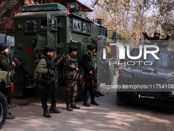 Indian Army soldiers stand alert near the encounter site after killing two militants in Sopore, Jammu and Kashmir, India, on November 8, 202...