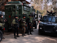 Indian Army soldiers stand alert near the encounter site after killing two militants in Sopore, Jammu and Kashmir, India, on November 8, 202...