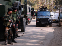 Indian Army soldiers stand alert near the encounter site after killing two militants in Sopore, Jammu and Kashmir, India, on November 8, 202...