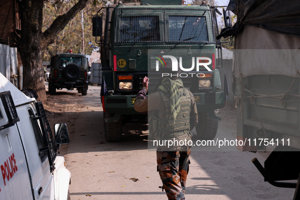 Indian Army soldiers stand alert near the encounter site after killing two militants in Sopore, Jammu and Kashmir, India, on November 8, 202...