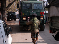 Indian Army soldiers stand alert near the encounter site after killing two militants in Sopore, Jammu and Kashmir, India, on November 8, 202...