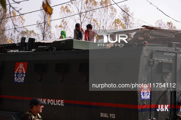 Kashmiri children look on as schools remain closed after an encounter between militants and security forces in which two militants are kille...