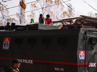 Kashmiri children look on as schools remain closed after an encounter between militants and security forces in which two militants are kille...