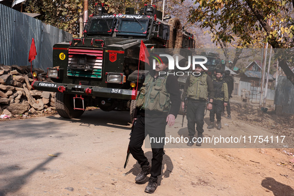 Indian army soldiers leave after killing two militants during an encounter in Sopore, Jammu and Kashmir, India, on November 8, 2024. 