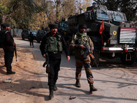 Indian Army soldiers leave after an encounter breaks out between militants and security forces in which two militants are killed in Sopore,...