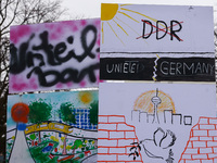 Artworks lined up in a four-kilometre-long open-air installation a day ahead of the 35th anniversary of the fall of the Berlin Wall. Berlin,...