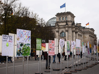 Artworks lined up in a four-kilometre-long open-air installation a day ahead of the 35th anniversary of the fall of the Berlin Wall. Berlin,...