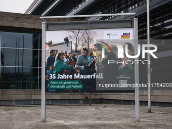 A banner is seen day ahead of the 35th anniversary of the fall of the Berlin Wall. Berlin, Germany on 8 November, 2024. (