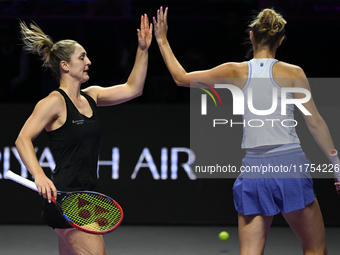 RIYADH, SAUDI ARABIA - NOVEMBER 08: Gabriela Dabrowski (L) of Canada and Erin Routliffe (R) of New Zealand during their semi-final match aga...