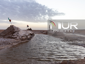 Salty water is seen as sun rises over Chott el Djerid salt lake in eastern Sahara, Tunisia on October 29, 2024. Chott el Djerid is the bigge...