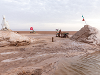 A local bedouin opens his souvenir stand as sun rises over Chott el Djerid salt lake in eastern Sahara, Tunisia on October 29, 2024. Chott e...