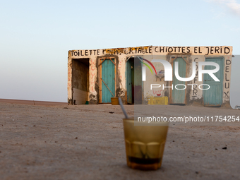 Public toilets are seen as sun rises over Chott el Djerid salt lake in eastern Sahara, Tunisia on October 29, 2024. Chott el Djerid is the b...