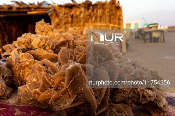 The rose of desert stones are seen on a stand as sun rises over Chott el Djerid salt lake in eastern Sahara, Tunisia on October 29, 2024. Ch...